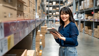 woman with clipboard checking inventory in warehouse