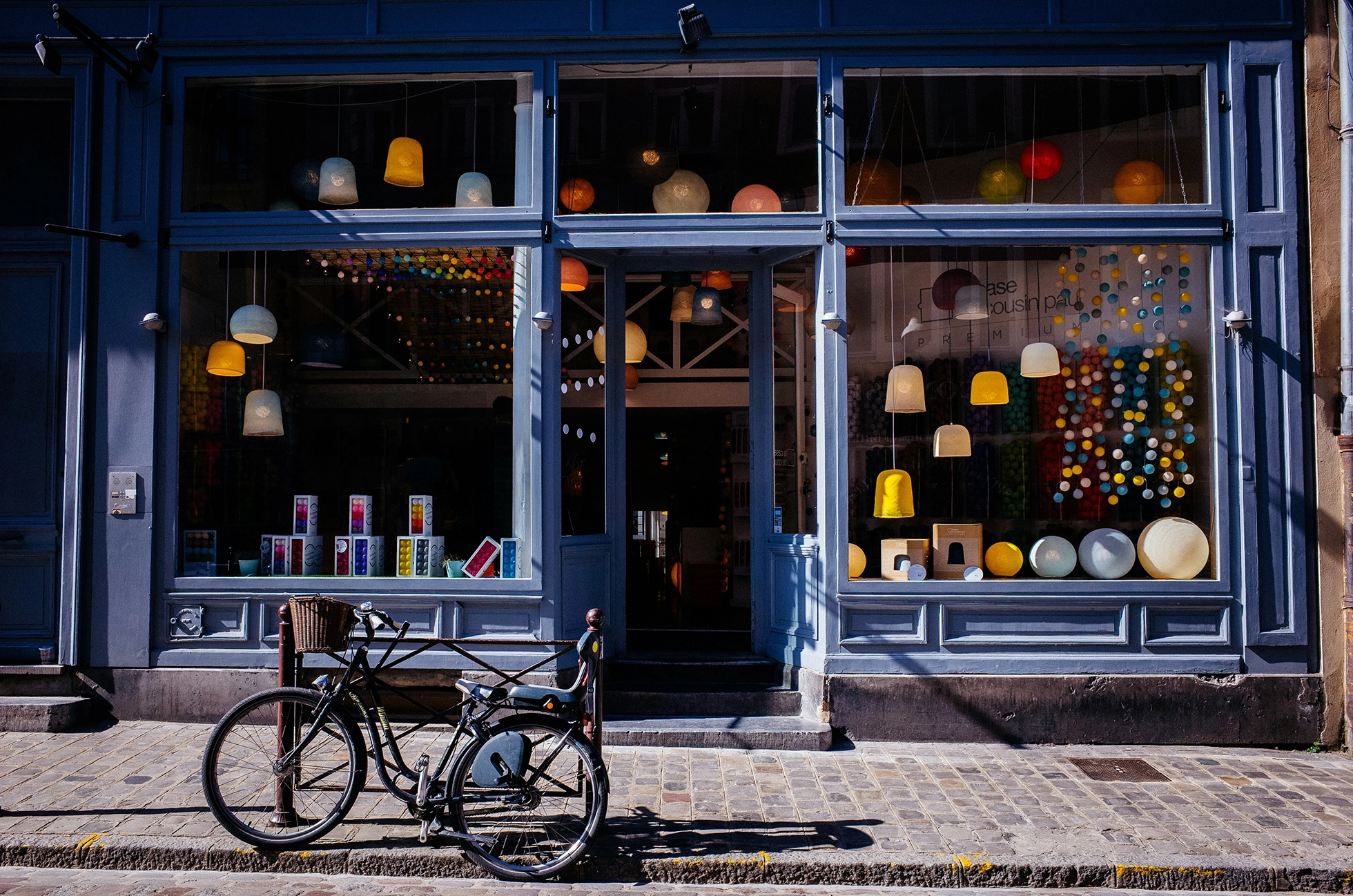 retail storefront commercial property painted blue with large windows