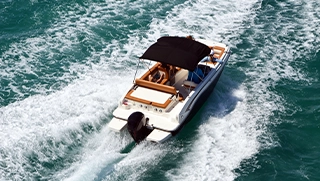 luxury boat, covered by boat insurance, on open water off the Florida coast