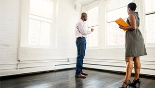 black man being shown Florida apartment by real estate professional