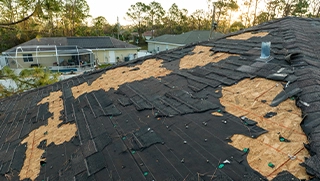 roof on Florida rental home missing shingles after storm